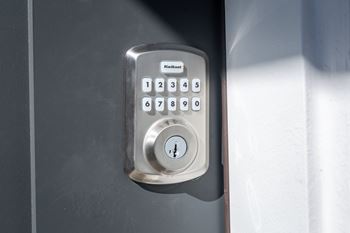 Digital keypad deadbolt lock on door